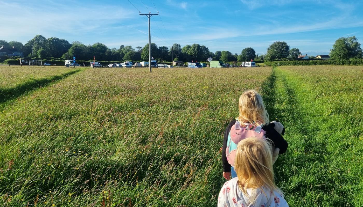 Girls walking to the campsite